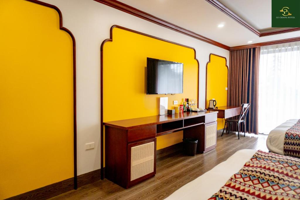 TV a/nebo společenská místnost v ubytování Le Chapa Hotel & Spa