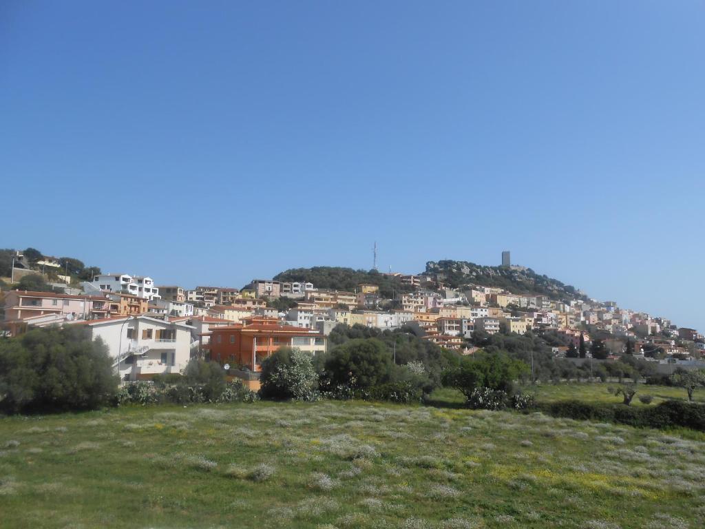 a city on top of a hill with houses at Residence L'Ancora in Posada