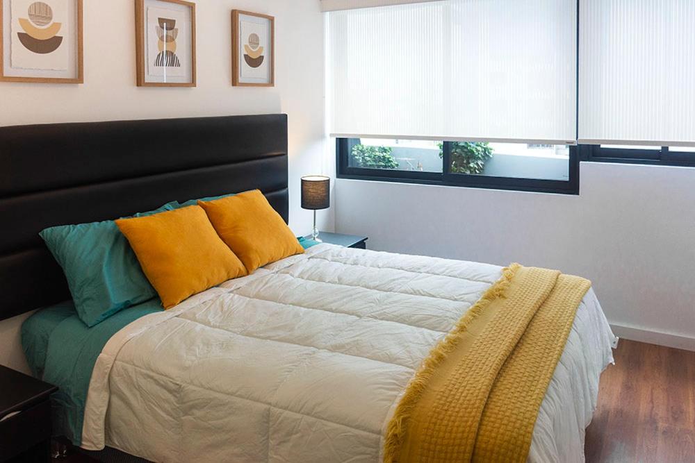 En eller flere senge i et værelse på Apartamento - Sky Tower 1005