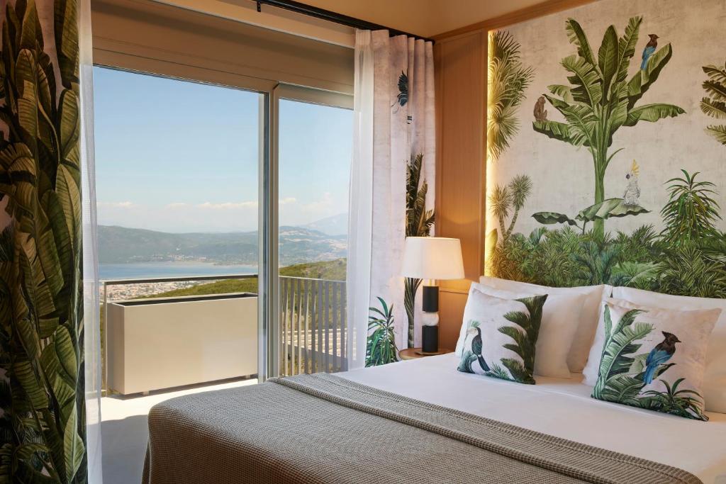 Postel nebo postele na pokoji v ubytování Epiphany Villas Lefkada