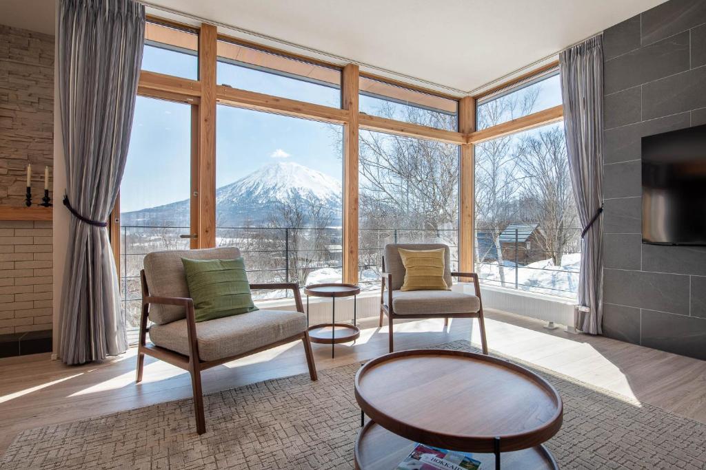 a living room with a view of a mountain at Akiyama in Kutchan
