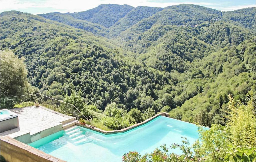 a swimming pool with a view of a mountain at 1 Bedroom Nice Apartment In Carcheto Brustico in Carcheto
