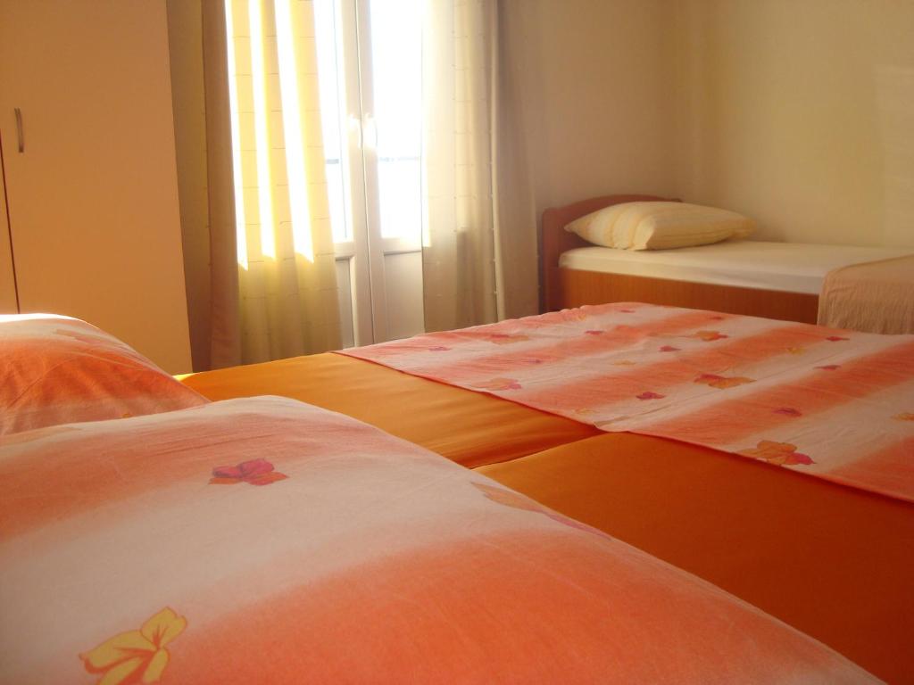 Postel nebo postele na pokoji v ubytování Apartments Roncevic #JOKO#