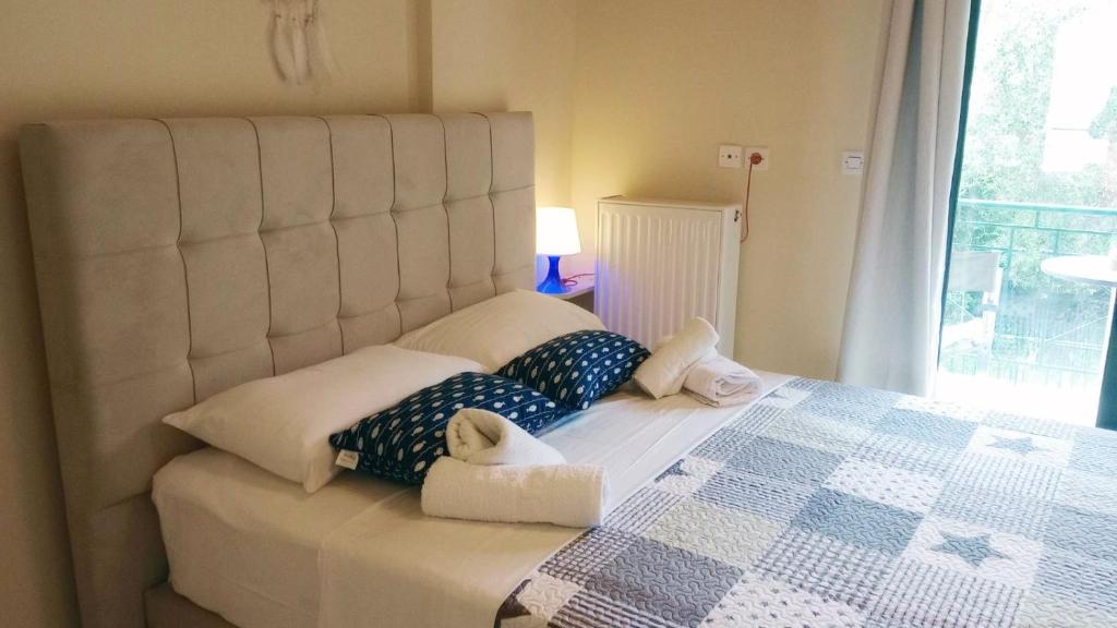 Postel nebo postele na pokoji v ubytování Rozos House