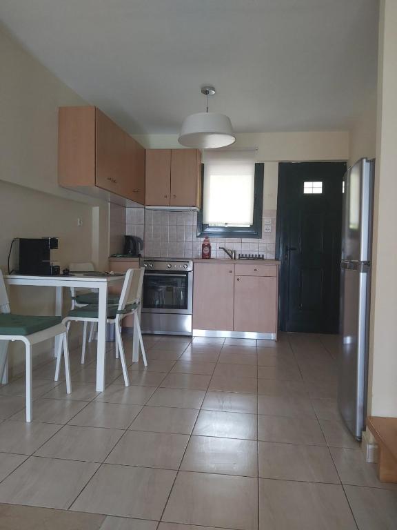 Kuchyň nebo kuchyňský kout v ubytování Rozos House