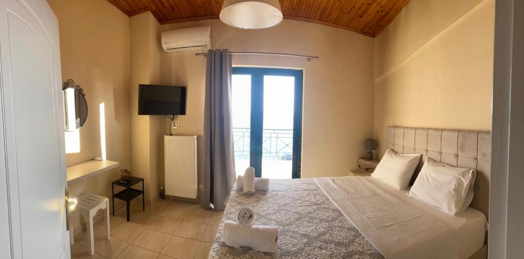 Postel nebo postele na pokoji v ubytování Rozos House