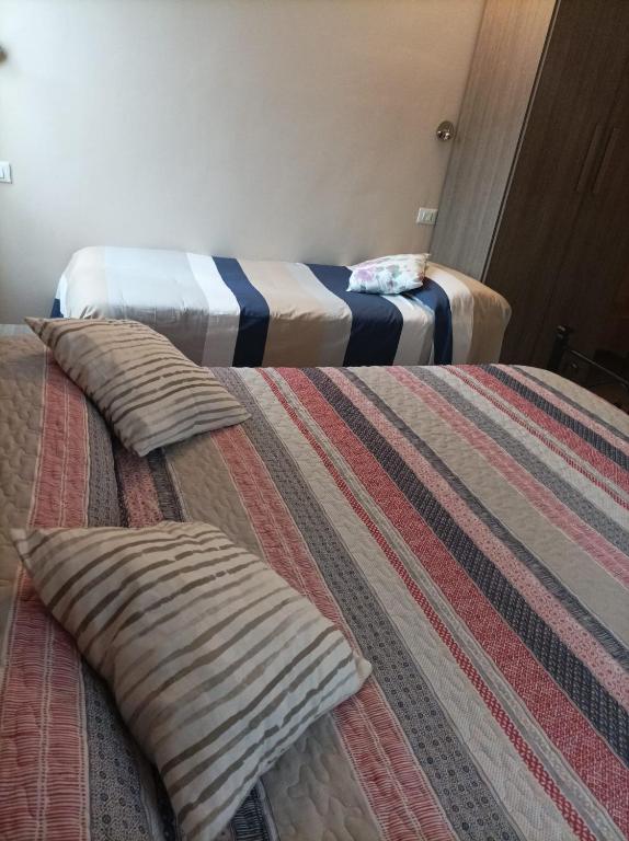 Postel nebo postele na pokoji v ubytování B&B Perbaccobar
