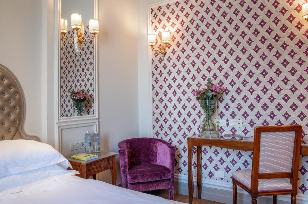 Postel nebo postele na pokoji v ubytování Hotel Villa Flori