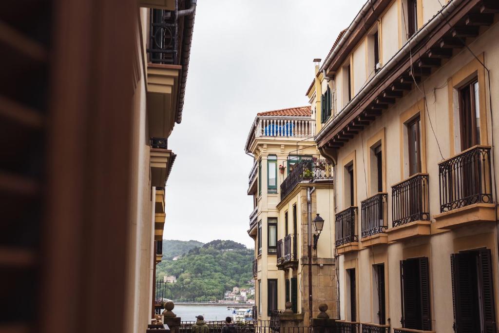 a view of a street in a city with buildings at San Sebastián DOT Rooms in San Sebastián