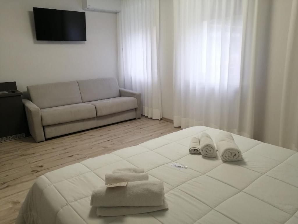 Postel nebo postele na pokoji v ubytování Hotel Siros