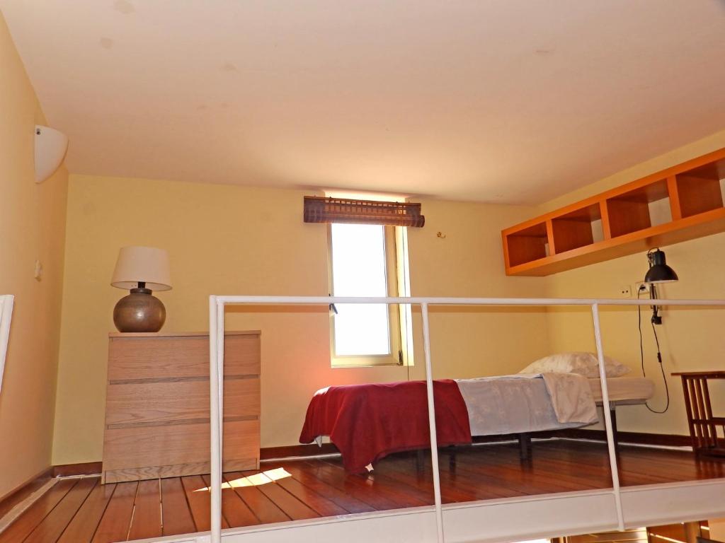 A bed or beds in a room at Apartamentos Medano - Duplex Playa