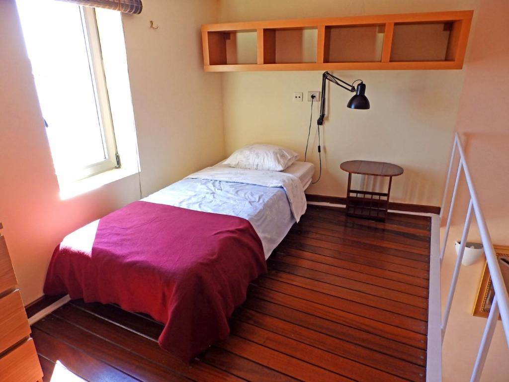 A bed or beds in a room at Apartamentos Medano - Duplex Playa