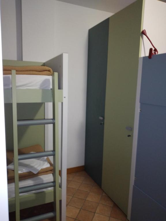Postel nebo postele na pokoji v ubytování Ostello Europa