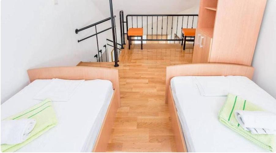 Postel nebo postele na pokoji v ubytování Majka Apartments