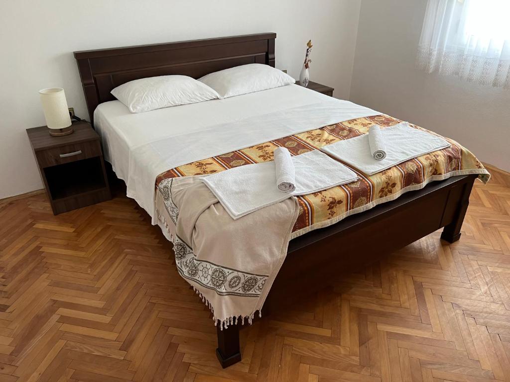 Postel nebo postele na pokoji v ubytování Apartments KRAJA