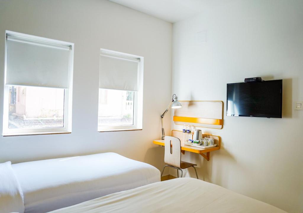 TV a/nebo společenská místnost v ubytování Bloom Hotel - Calangute
