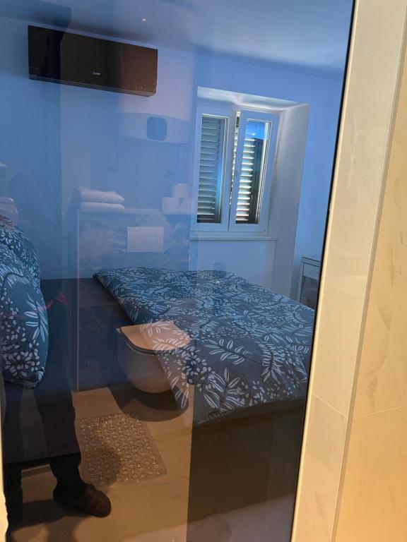 Postel nebo postele na pokoji v ubytování Madonna luxury rooms