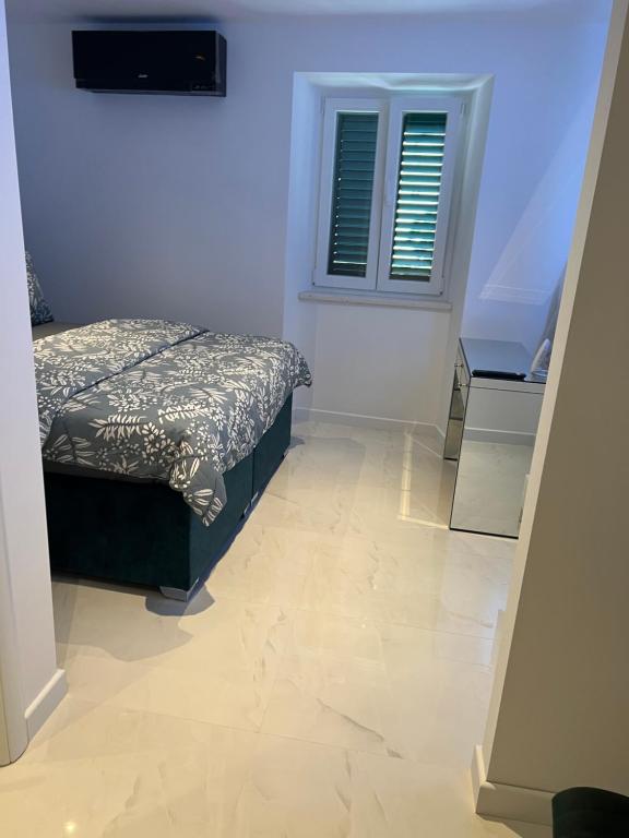Postel nebo postele na pokoji v ubytování Madonna luxury rooms