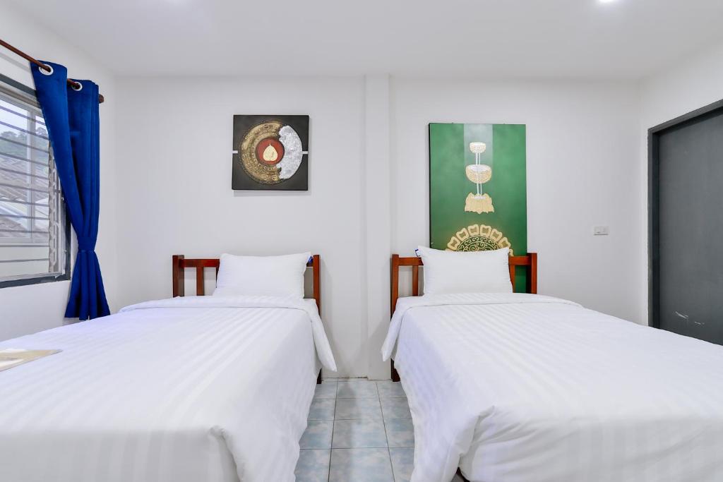 Postel nebo postele na pokoji v ubytování GP House Krabi Aonang Beach