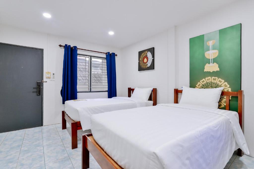 Postel nebo postele na pokoji v ubytování GP House Krabi Aonang Beach