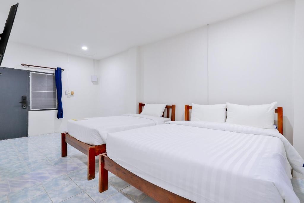 Postel nebo postele na pokoji v ubytování GP House Krabi Aonang Beach