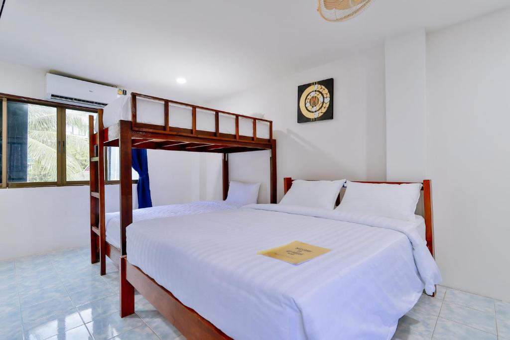 Postel nebo postele na pokoji v ubytování GP House Krabi Aonang Beach