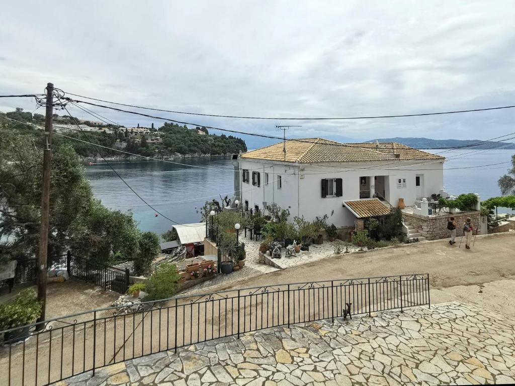 a white house with a view of the water at Villa Elena in Kalami