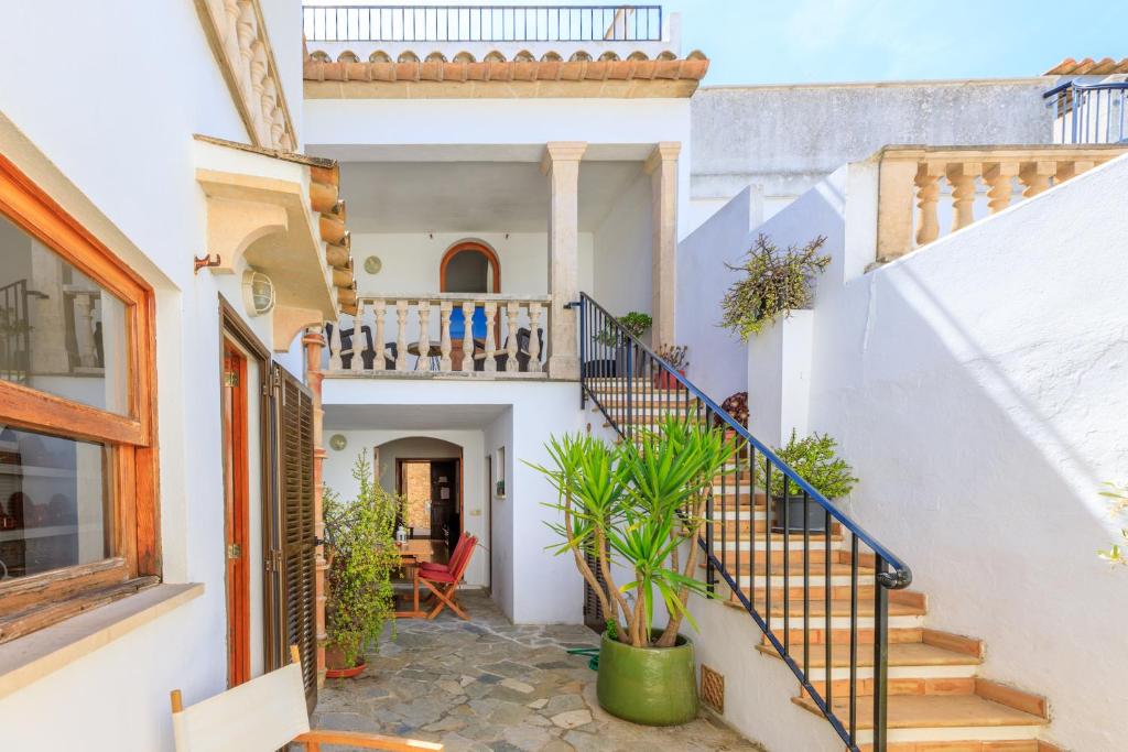 a staircase in a home with white walls at Casa Torres in Pollença