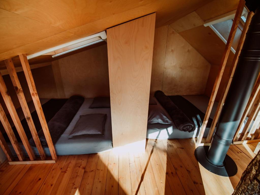 an overhead view of a room with two bunk beds at StromDom Dva Duby in Nová Baňa