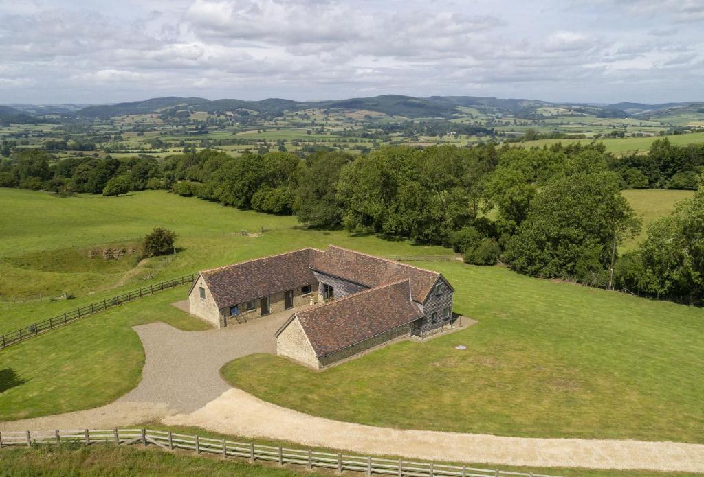 an overhead view of a building in a field at Wassell Barn in Craven Arms