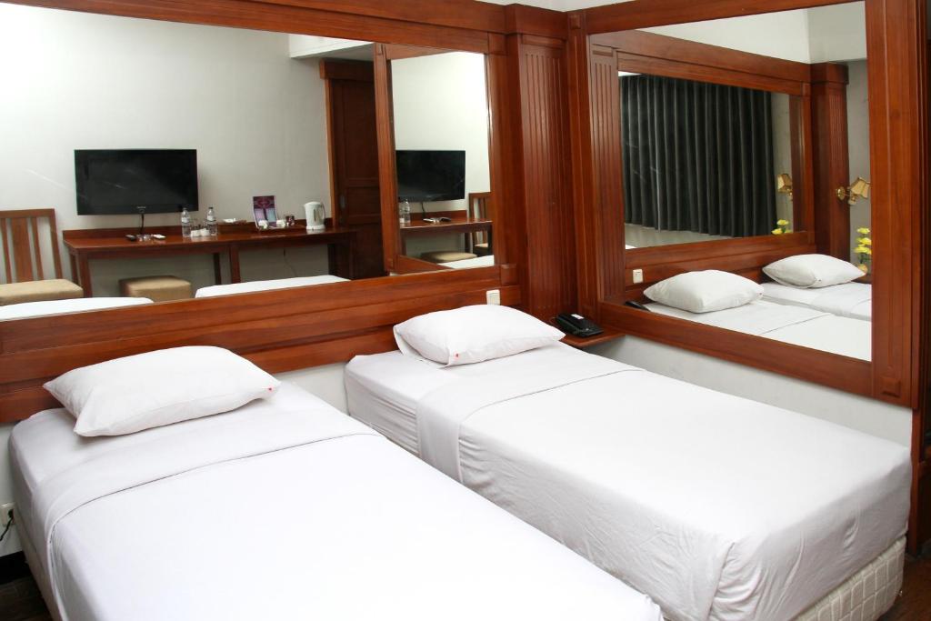 Katil atau katil-katil dalam bilik di Wirton Hotel