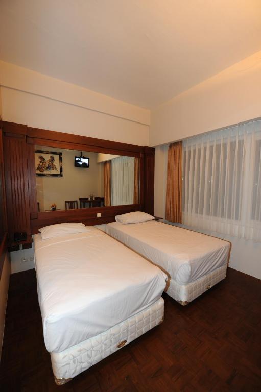 Katil atau katil-katil dalam bilik di Wirton Hotel