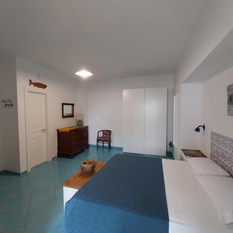 A bed or beds in a room at La Casa Di Massimiliano - Villa del Sole