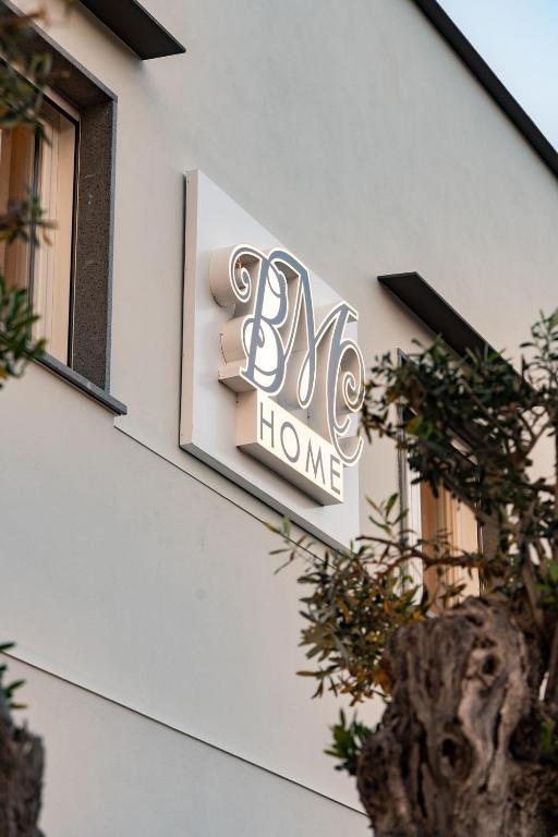 a sign for a home on the side of a building at BMC Home in Boscotrecase