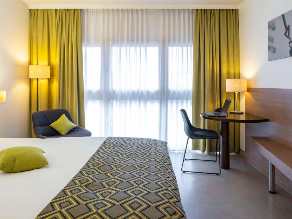 Postel nebo postele na pokoji v ubytování Hotel Mercure Graz City