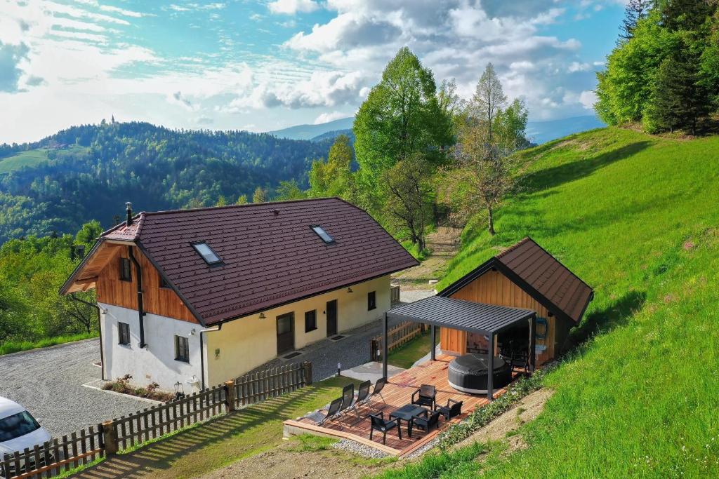 an aerial view of a house on a hill at Villa Richterberg with Sauna & Hot Tub in Slovenj Gradec