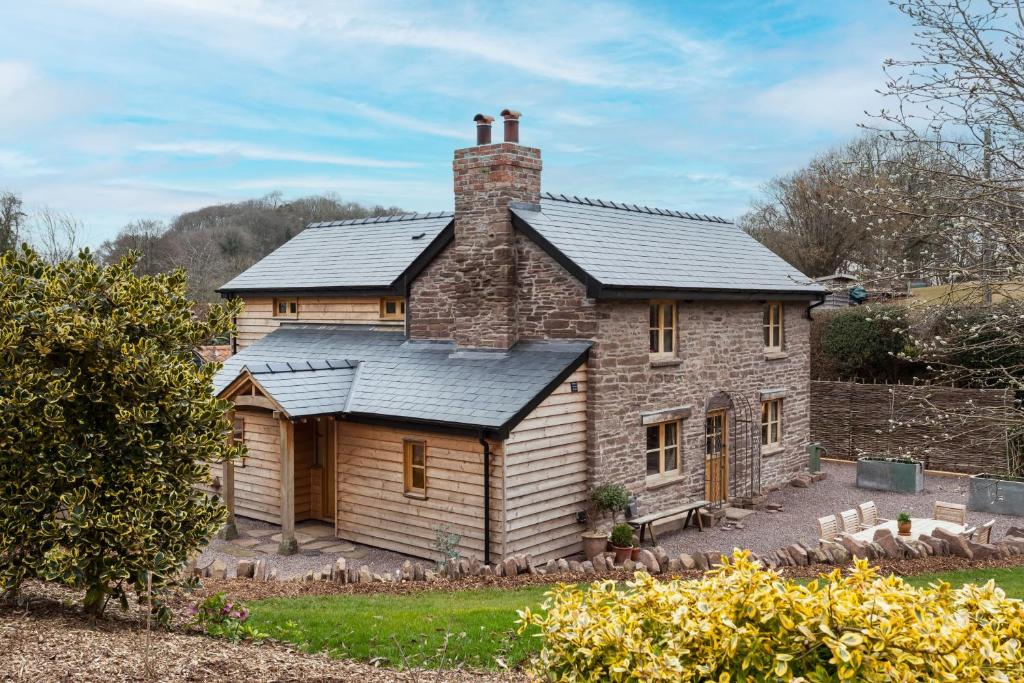 an old stone house with a slate roof at Stone House in Leominster