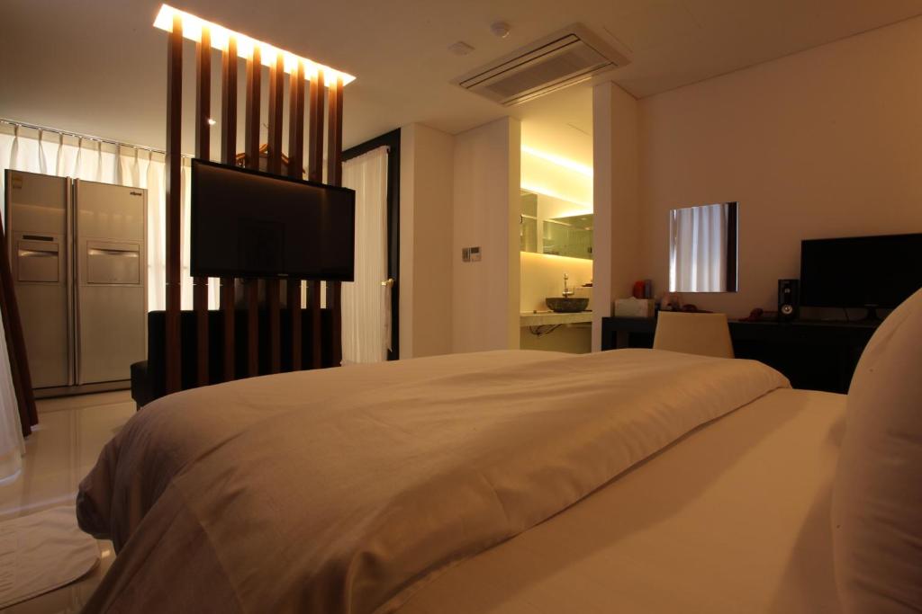 Postel nebo postele na pokoji v ubytování Yuwon Hotel