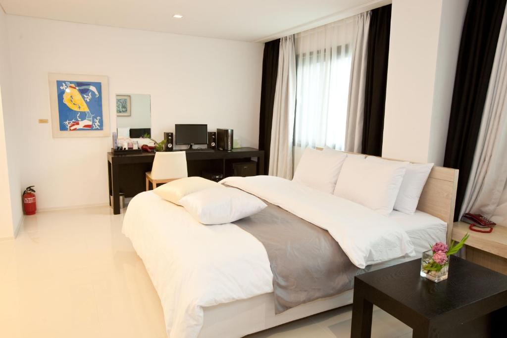 Postel nebo postele na pokoji v ubytování Yuwon Hotel
