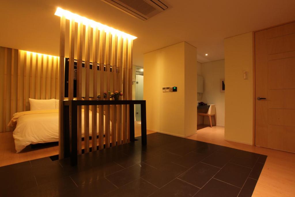 Postel nebo postele na pokoji v ubytování Yuwon Hotel