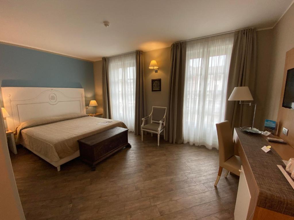 Postel nebo postele na pokoji v ubytování Hotel Monteverde