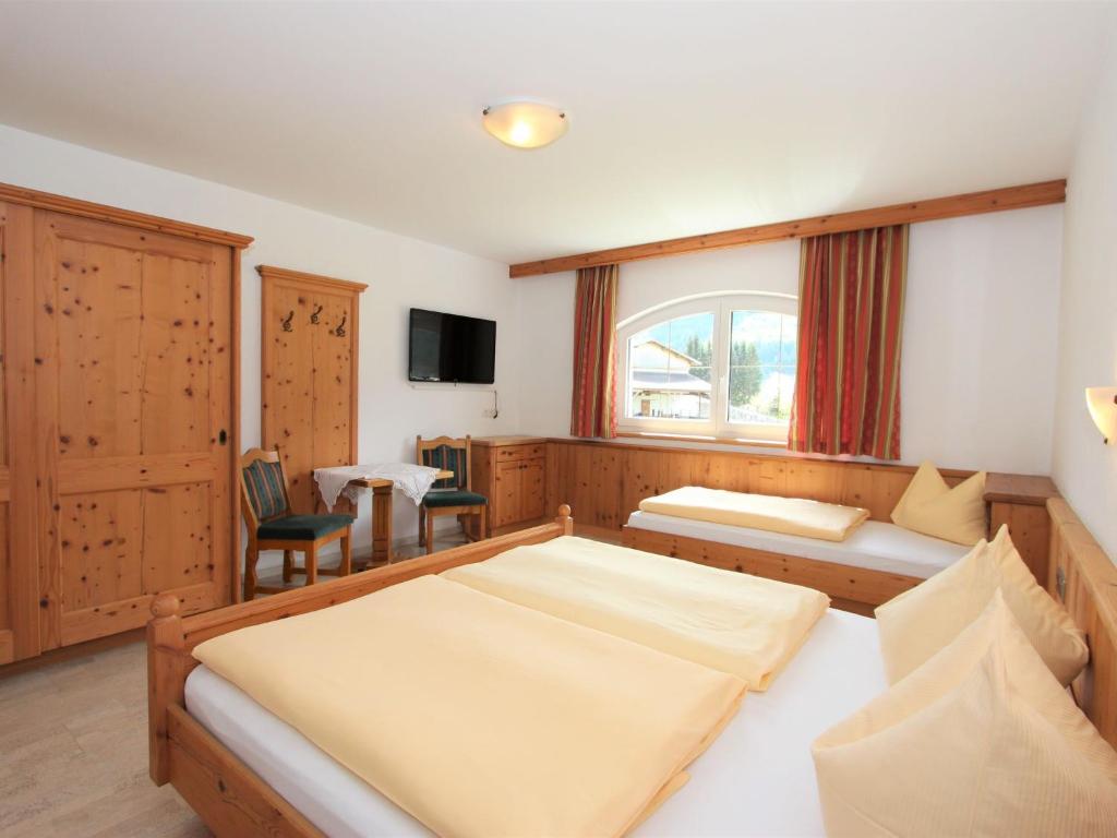 A bed or beds in a room at Apartment Monika-1 by Interhome