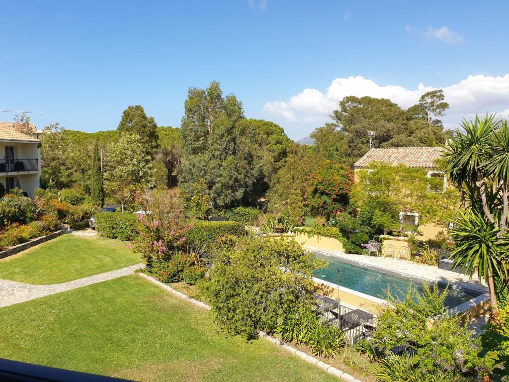 an aerial view of a garden with a swimming pool at Studio studio 18-20m2 by Interhome in Calvi