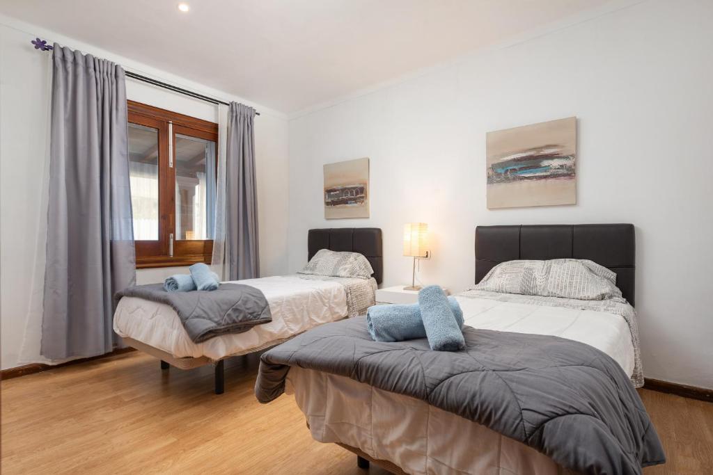 Postel nebo postele na pokoji v ubytování Villa Llimona