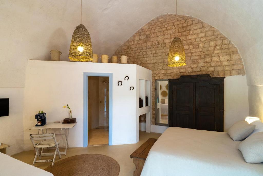 Postel nebo postele na pokoji v ubytování Masseria Soluco
