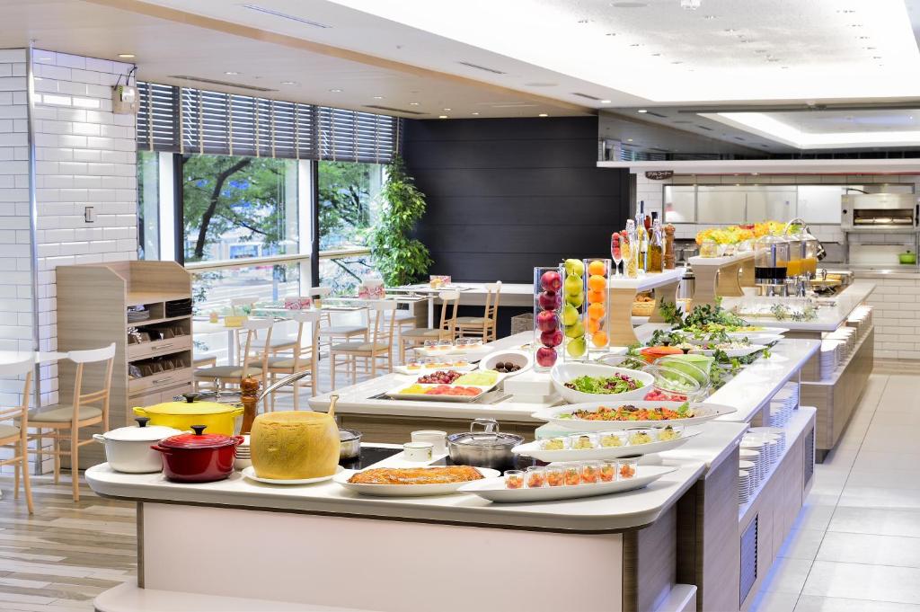a buffet line with many plates of food at Hotel Nikko Fukuoka in Fukuoka