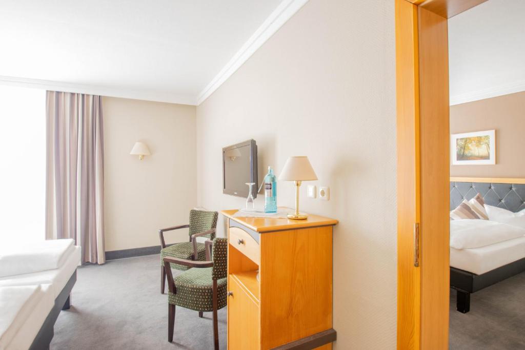 Postel nebo postele na pokoji v ubytování Hotel Tanne Ilmenau