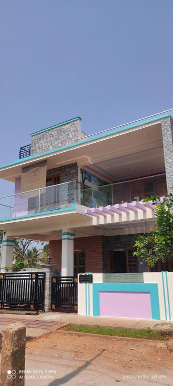 a large building with a balcony on the side of it at Kailash Guest Home in Mysore