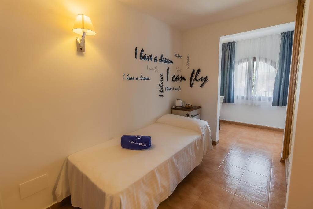 Posteľ alebo postele v izbe v ubytovaní Paloma Blanca Boutique Hotel