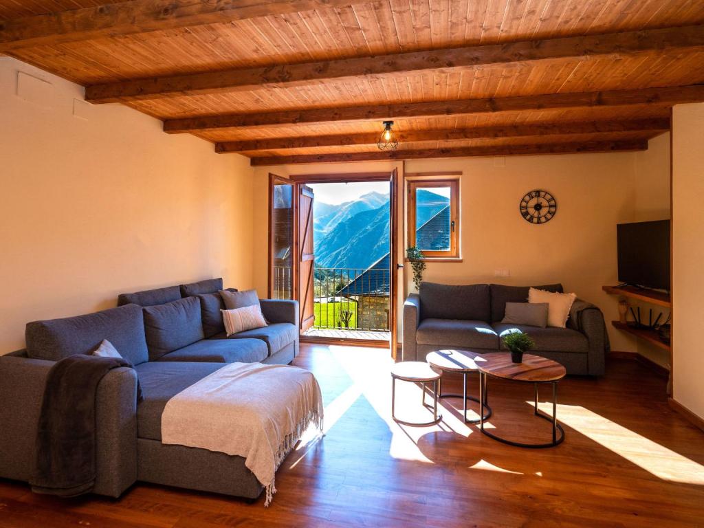 a living room with a couch and a table at Apartment Peak by Interhome in Taüll